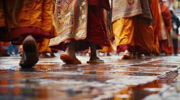 The intricate patterns on the robes seem to come to life as the monks move about the courtyard photo