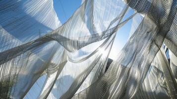 Despite the chaos of construction the soft white netting stands out as a gentle reminder of safety and protection photo