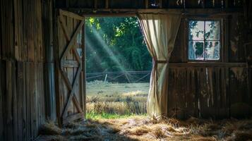 The scent of fresh hay and the gentle rustle of windcaught curtains create a tranquil atmosphere inside the old barn photo