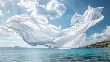 A billowing cotton sheet hovering over a tranquil bay creating a peaceful and calming mood photo