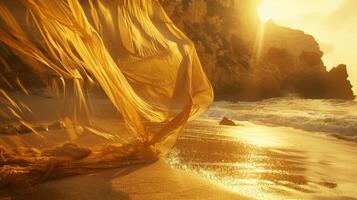 Against the golden sands and rocky cliffs fabric sways and flows like a mirage photo