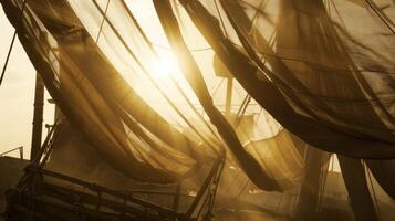Thick bolts of fabric are tied securely to the crane creating a makeshift canopy in the wind photo