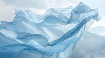 The high winds have lifted a baby blue sheet high into the sky creating an almost ethereal and dreamlike scene on the mountaintop photo