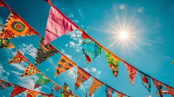A closeup of bunting flags with intricate patterns fluttering in the air photo