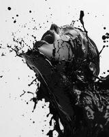 Inklike splashes of black and white create a dynamic and dramatic effect on the canvas. Black and white art. photo