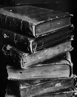 Each book bears its own unique marks and imperfections a testament to its longevity. Black and white art. photo