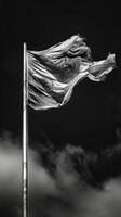 The wind tugs at the fabric of a flag creating a dramatic and dynamic pattern. Black and white art. photo