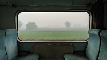 The changing density of the fog brings an everchanging view to the train journey photo