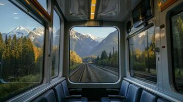 Rolling hills give way to jagged peaks as the train traverses the mountain terrain photo