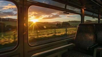 As the sun sets behind the rolling hills the train journey through the countryside comes to a peaceful and satisfying end photo