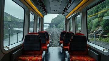 Steep cliffs hug either side of the train as it crosses the river on the bridge photo