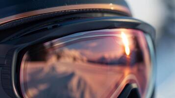 The lens of the goggles has a sleek gradient tint transitioning from rose gold at the top to a deep bronze at the bottom photo