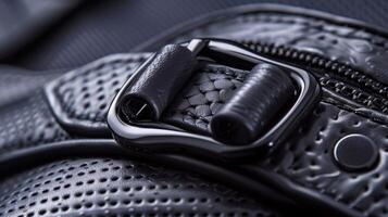 A detailed shot of the adjustable the goggles with intricate stitching and a smooth metallic buckle photo