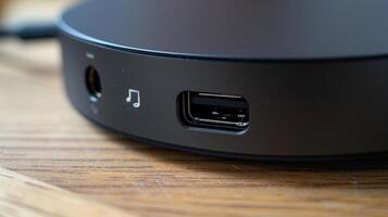 A detailed shot of the charging port on a streaming device with a small icon indicating which direction to insert the cord photo