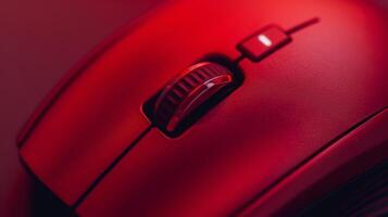 A macro shot of a red wireless mouse showcasing its precise laser tracking capabilities photo