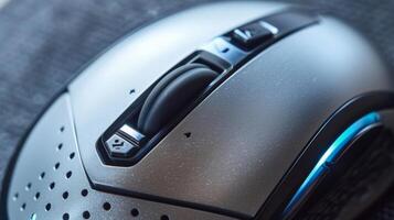 A closeup of a silver wireless mouse highlighting the various buttons and advanced optical tracking technology photo