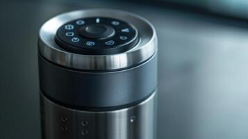 A closeup of the touchsensitive buttons on the side of a smart water bottle allowing the user to quickly access various features such as temperature settings and reminders photo