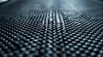 Closeup of the textured nonslip surface of a smart treadmill belt providing traction and stability for runners during intense workouts photo