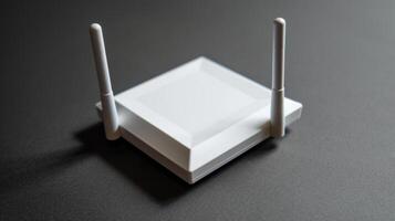 An angled shot of a white adapter with a glossy finish and two antennas protruding from the top giving it a futuristic look photo