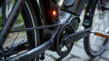Closeup of the pedalassist sensor located near the crank of the bike with precise measurement markings and a small LED light indicating activation photo