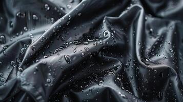 An upclose look at the hightech fabric used to construct a waterproof and windproof hiking jacket with a soft velvety texture and a glossy sheen photo