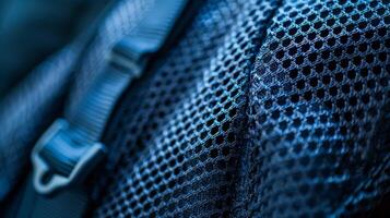 An upclose look at the mesh paneling on the side of a backpack designed to allow for ample airflow and ventilation during long hikes photo