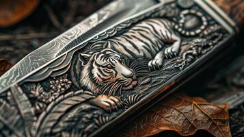 The blade of a pocket knife showcasing a stunning intricate engraving of a wild tiger in the wild. The handle is made of genuine leather and has a soft supple texture photo