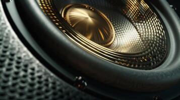 The metallic coils of a subwoofer are visible through a out in its sleek black exterior hinting at the powerful bass it can produce photo