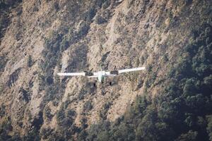 Lukla, Nepal - 14th november, 2023 - small aircraft takes off on the runway of the Tenzing-Hillary airport Lukla - Nepal, Himalayas photo