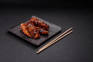 Delicious chicken fillet sliced and baked with teriyaki sauce photo