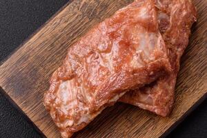 Raw pork or beef ribs in honey sauce with salt, spices photo
