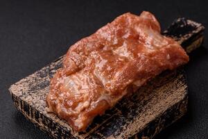 Raw pork or beef ribs in honey sauce with salt, spices photo