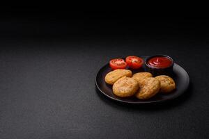 Round fish or chicken nuggets with salt and spices photo