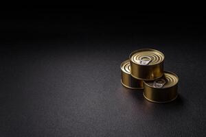 Round metal can with canned meat or fish with a key photo