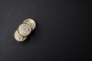 Round metal can with canned meat or fish with a key photo