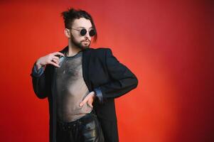 Gay man on a colored background in the studio. The concept of the LGBTQ community. Equality. photo