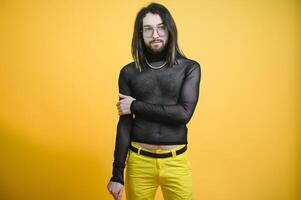 Gay man on a colored background in the studio. The concept of the LGBTQ community. Equality. photo