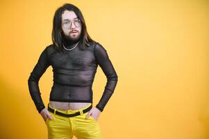 Gay man on a colored background in the studio. The concept of the LGBTQ community. Equality. photo