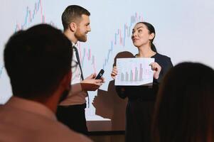 Group of business people working. Technical price graph and indicator, red and blue candlestick chart and stock trading computer screen background. Traders analyzing data photo