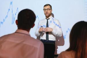 Analyzing data, graphs and reports for investment purposes. Creative teamwork traders. photo