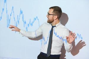 Stock Market Trader Working Investment Charts, Graphs, Ticker, Diagrams Projected on His Face. Financial Analyst and Digital Businessman Selling Shorts and Buying Longs photo