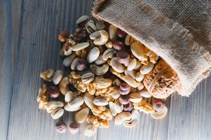a mix of nuts in a craft bag photo