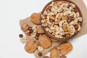 Mixed nuts on a plate. White background photo