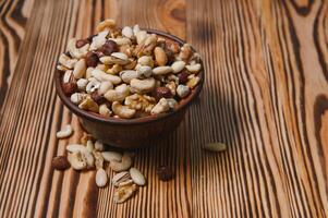 mix nuts on a wooden table photo