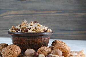 mix nuts on a wooden table photo