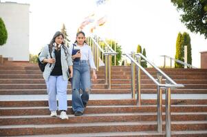 Group of smiling multiethnic near university campus photo