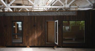 Newly built single storey prefabricated modular building. Prefabricated mobile wooden house at construction site photo