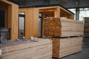 Newly built single storey prefabricated modular building. Prefabricated mobile wooden house at construction site photo