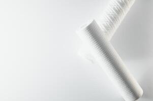 filter cartridges for water on a white background. Installation of reverse osmosis water purification system. photo