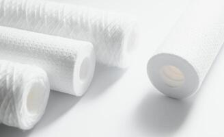filter cartridges for water on a white background. Installation of reverse osmosis water purification system. photo
